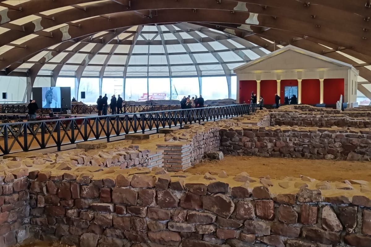 The covered Roman archaeological ruins of Mediana in Niš, excavated stone walls beneath a domed shelter.