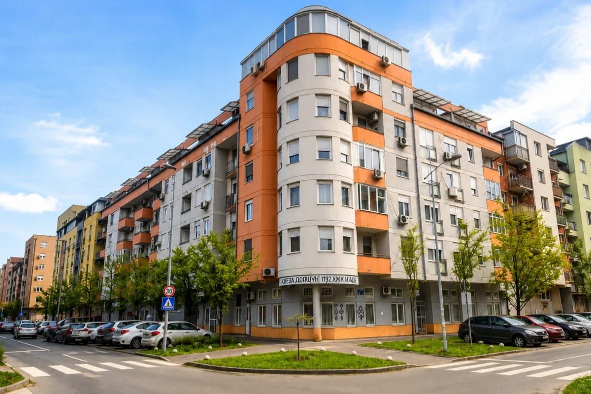 A modern residential apartment building on a quiet corner in the Detelinara district of Novi Sad.