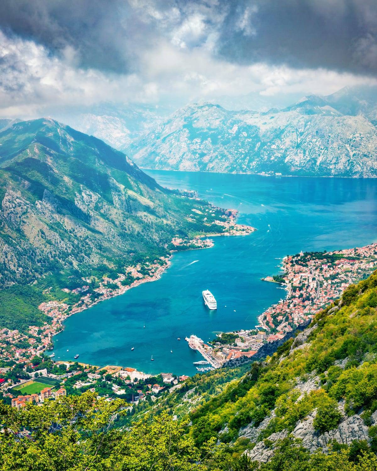 Aerial view of the Bay of Kotor with a cruise ship among the mountains, Montenegro