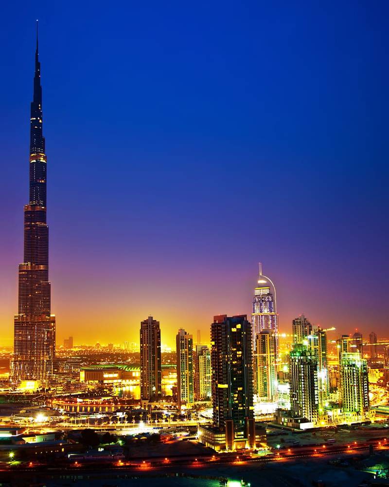 The Dubai skyline at dusk with the Burj Khalifa towering over the city, United Arab Emirates