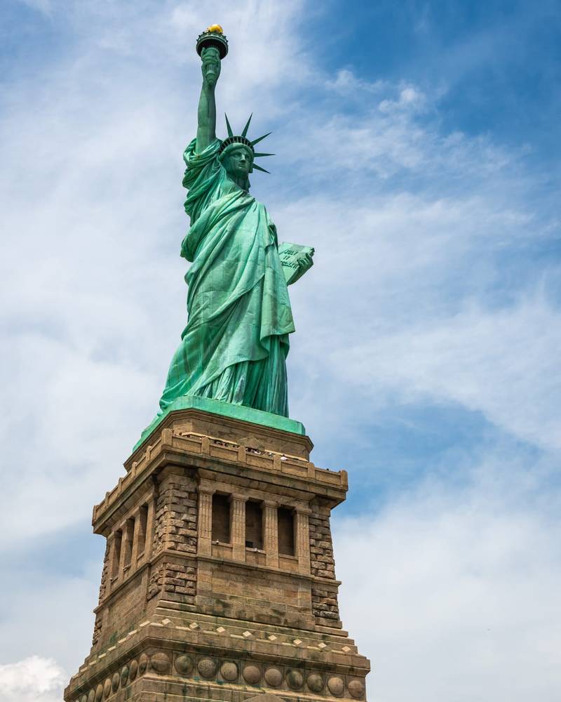 The Statue of Liberty against a blue sky, New York, United States